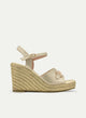 GOLDEN WEDGE SANDAL WITH GOLDEN BUCKLE.