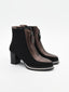 Elegant black booties with metallic detail and Azr closure