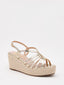 Metallic gold wedges with crisscross straps