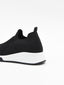 Zapatilla slip-on negra con suela blanca