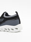 Zapatilla slip on negra con suela ergonómica blanca