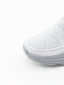 Zapatilla slip-on de punto knit en degradado gris con suela chunky ondulada gris y logo Nyrex en relieve.