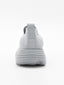 Zapatilla slip-on de punto knit en degradado gris con suela chunky ondulada gris y logo Nyrex en relieve.