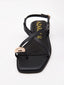 Sandalias planas negras con detalle metalizado
