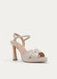 SANDALIA BEIGE DE TACÓN ALTO CON PLATAFORMA Y TIRAS FLOR