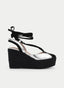 SANDALIA CUÑA NEGRA Y PLATA CON LAZADA